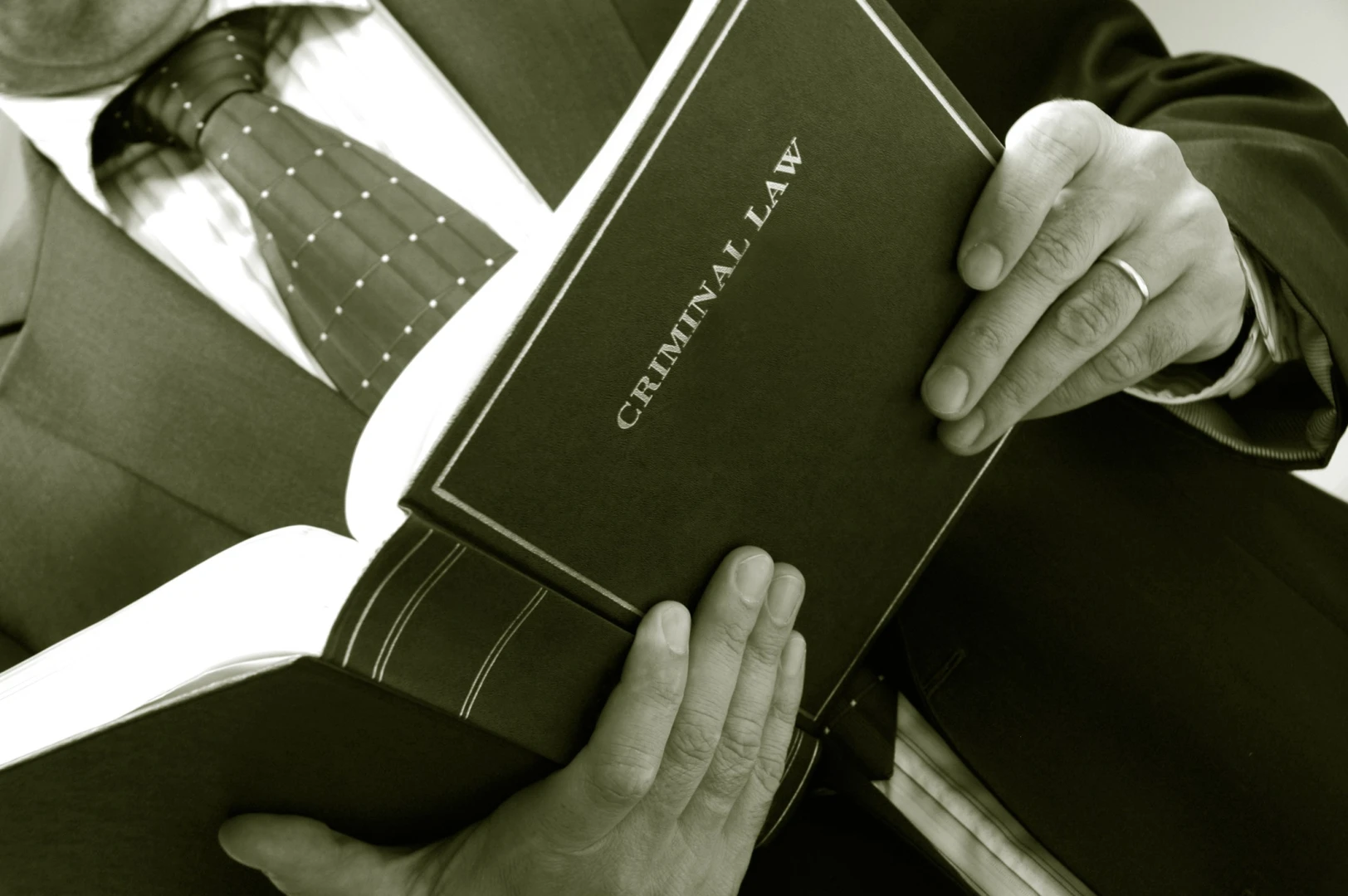 man-holding-criminal-book-1